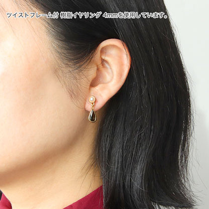 Resin earrings with twist frame, rhodium color