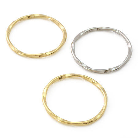 Metal ring parts twisted round gold