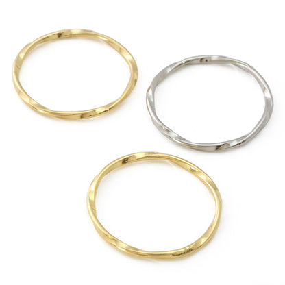 Metal ring parts twisted round gold